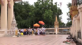 A village celebrates the event of a man becoming a monk in Thailand.