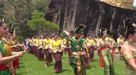 Celebration and dancing at a beautiful temple on a hilltop in Thailand, in celebration of completion of a serpent construction.
