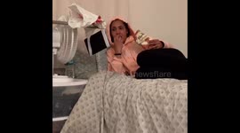 A tablet is attached to a plastic bag