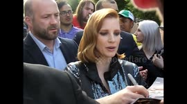 Jessica Chastain signs autographs for fans outside London hotel