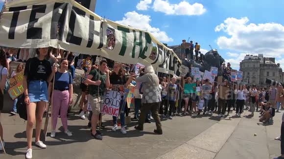 Youth climate change activists gather at Nelson's Column in central London
