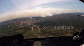 Aerial view of gigantic wildfire burning west of Alberta, Canada