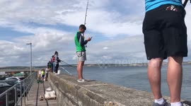 Locals fishing on Pier at Ballycotton, Ireland