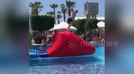 Funny moment UK tourist overtakes Russian in swimming trunks on aquatic assault course