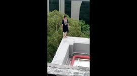 Woman threatens to jump off five-storey building after being fired in north India