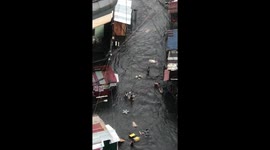 Locals rush to salvage possessions as rainy season floods hit the Philippines