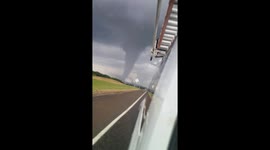 ''It's coming our way!'' Texas driver speeds away from ominous tornado