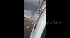 ''It's coming our way!'' Texas driver speeds away from ominous tornado