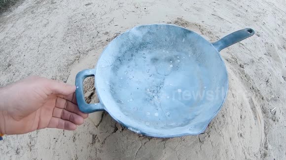 Testing iron cast cooking pan against explosion.