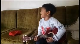 This child feels playing guitar and singing like Kurt Cobain