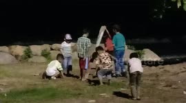 a number of small children in the Padang put the mercury flying into the pit of the sand crab to catch