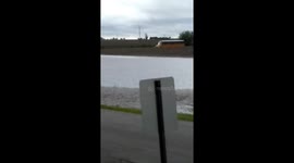 Buoyant bus braves flooded Illinois street to transport school kids