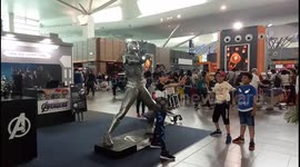 Kids selfie & mimic Ironman's action in the airport