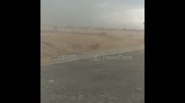 Moment woman gets caught in unexpected dust Microburst