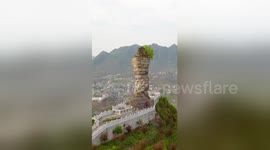 Mysterious giant stone has stood on mountaintop for thousands of years in China