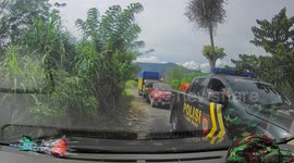Dashcam capture Indonesian police using mobile phones while driving a police car