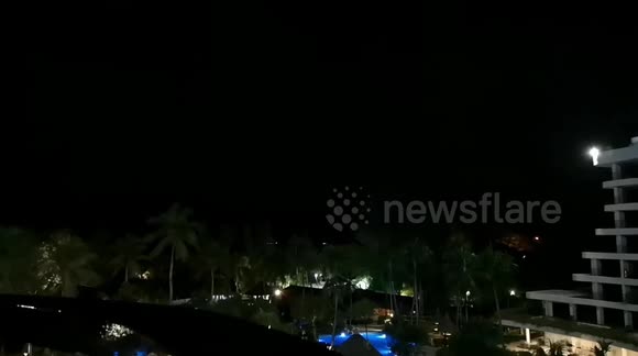 Night sky fork lightning over the beach