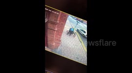 CCTV footage captures horrifying moment UK courier stumbles into bus after falling off bike