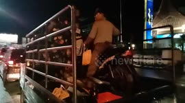 a man in the city of Padang rode a motorbike over a car