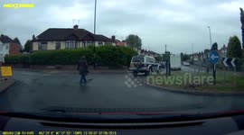 Woman adjusts herself in the middle of a roundabout
