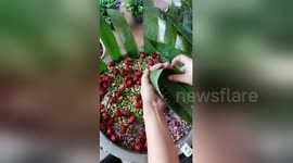 Chinese woman shows how to make 'Zongzi' for Dragon Boat Festival