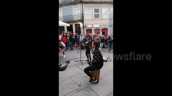 England fans sing with busker in Porto and receive guard of honour from locals