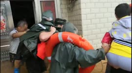 Woman trapped in flooded house cries out after firefighters finally arrive to rescue her