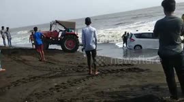 New car pulled in by high tide in Indian Beach