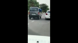 Watch - Video shows man brandishing gun on road in moving car in Greater Noida