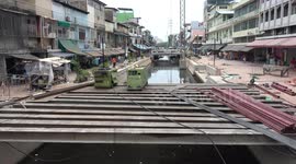 Locals Use Rusty Iron Girders As Make-Shift Bridge