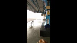 Winds blow away chairs in Indian railway station