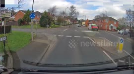 car pulls out on mini roundabout