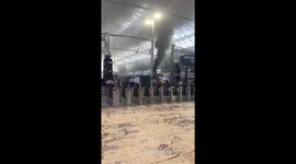 Smoke pouring from a Scotrail train in Glasgow's Queen Street station.