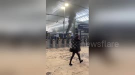 Newsflare Edit -Smoke pouring from a Scotrail train in Glasgow's Queen Street station.