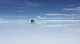 Salt flat in Bolivia has surface like mirrored glass during rainy season