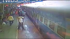 Watch - Man miraculously escape while boarding a running train