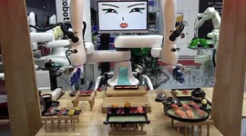 Cutting-edge robots pour beer and make sushi at trade show in Bangkok