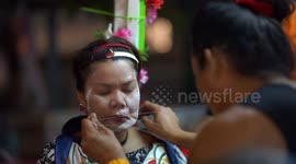 Facial beauty treatment in Thailand using a Chinese technique called face threading.