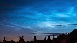 Glowing UK clouds look neon blue