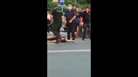 Protesters in Tbilisi, Georgia are tended to by paramedics after being caught in tear gas