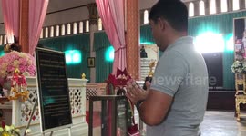 Chanting in Sanskrit as part of Buddhist religion when visiting a temple in Thailand