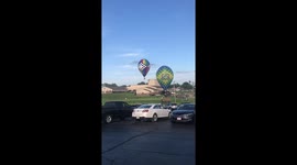 Man getting run over by a hot air balloon