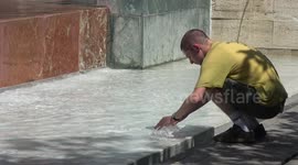 Residents in Spain use fountains to cool down amid European heatwave