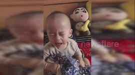 Chinese baby changes his crying face into laughter in seconds