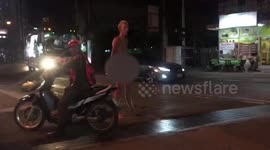 Naked tourist detained after standing in the middle of road and refusing clothes