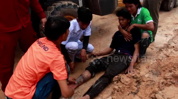 Escaped Using Backhoe Dramatic moment builder is rescued from overturned backhoe that burst ...