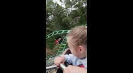 Kids halarious face on rollercoaster