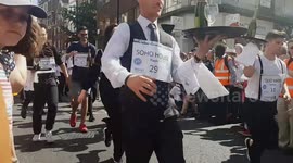 Waiters in London's Soho compete in traditional champagne street race