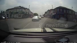 Car getting flashed by camera at traffics light