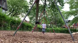 Canadian dad manages to run gauntlet of swingset pendulums